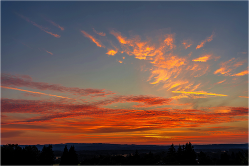 Main image Fire in the Sky Over Silhouetted Hills